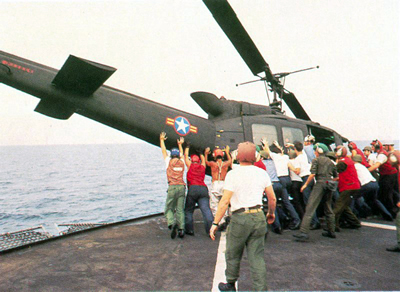 Vietnamese_UH-1_pushed_over_board,_Operation_Frequent_Wind